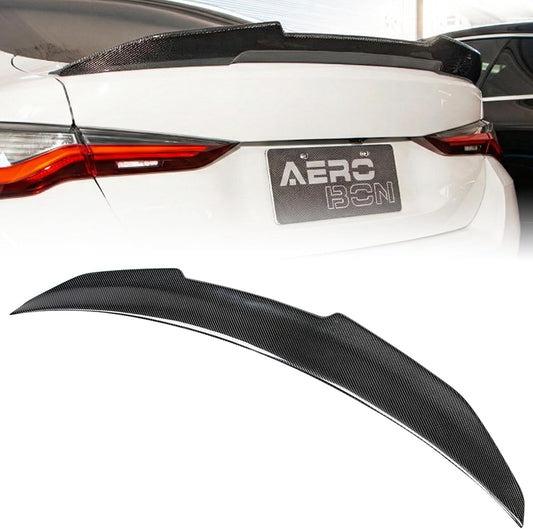 A carbon fiber rear trunk spoiler shown both installed on a white car and as a standalone product against a white background.